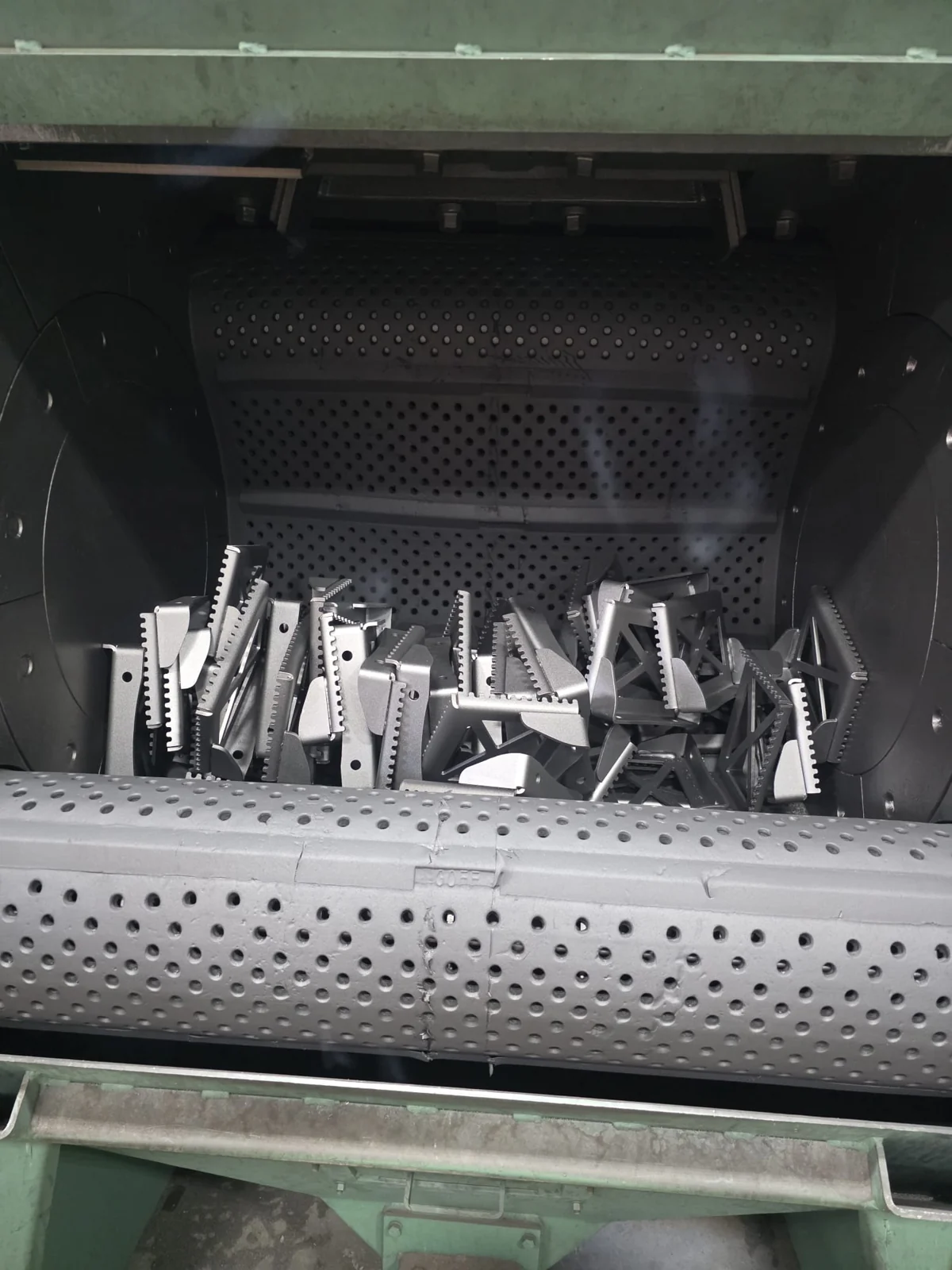 Metal components inside a blasting machine