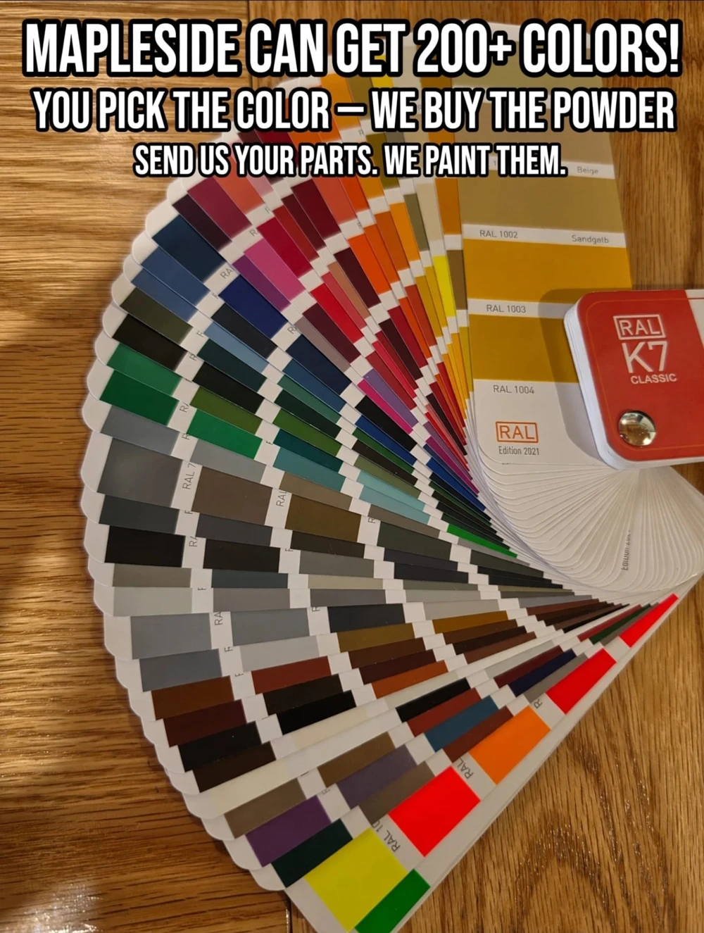 Fan of RAL colour samples showing a wide selection of powder coating colours